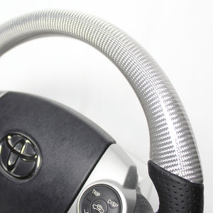 REAL PREMIUM SERIES OVAL SHAPE SILVER CARBON GLOSSY BLUE X SILVER EURO STITCH STEERING WHEEL FOR TOYOTA PRIUS 30  30-BST-SLC