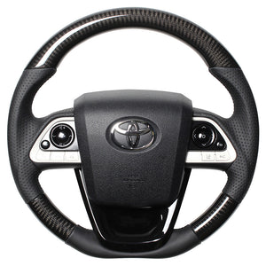 REAL PREMIUM SERIES SET BLACK CARBON STEERING + PIANO BLACK UNDER PAD BLACK EURO STITCH STEERING WHEEL FOR TOYOTA PRIUS 50  50P-BKC-BK-PBP