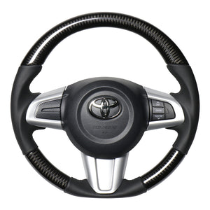 REAL ORIGINAL SERIES SOFT D SHAPE BLACK CARBON BLACK STITCH STEERING WHEEL FOR DAIHATSU TANTO LA600S: KOUKI LA610S: KOUKI  M90-BKC-BK