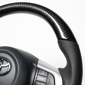 REAL ORIGINAL SERIES SOFT D SHAPE BLACK CARBON BLACK STITCH STEERING WHEEL FOR TOYOTA TANK 900  M90-BKC-BK