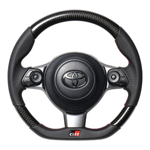 REAL ORIGINAL SERIES EMBLEM TYPE D SHAPE BLACK CARBON RED X BLACK EURO STITCH STEERING WHEEL FOR TOYOTA PRIUS PHV GR SPORT 50  GRM-BKC-RD