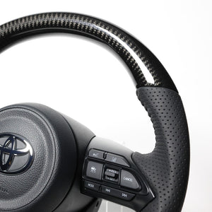 REAL ORIGINAL SERIES D SHAPE BLACK CARBON BLACK STITCH STEERING WHEEL FOR TOYOTA AQUA MXPK10  TYJ-BKC