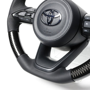 REAL ORIGINAL SERIES D SHAPE BLACK CARBON BLACK STITCH STEERING WHEEL FOR TOYOTA AQUA MXPK10  TYJ-BKC